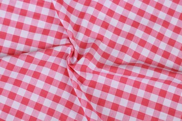 wrinkled classic pink plaid fabric or tablecloth background
