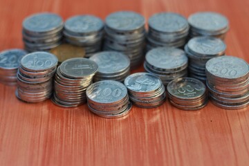 a stack of rupiah coins, indonesian currency