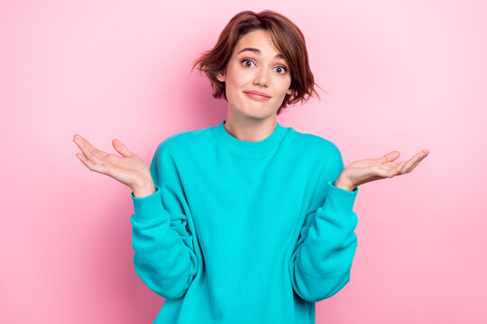 Portrait of cute pretty girl wear stylish cyan pullover arms palms showing gesture no answer excuse me isolated on pink color background