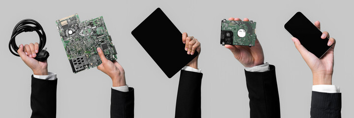 Panoramic banner hand holding electronic waste on isolated background. Eco-business recycle waste...