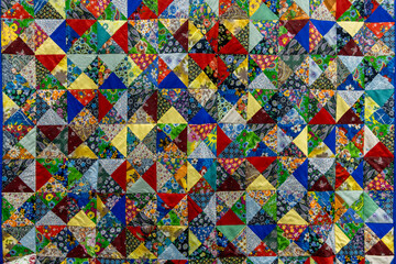 Fototapeta premium Handmade Patchwork Quilt Background With Colorful Rustic Ethnic Geometric Pattern