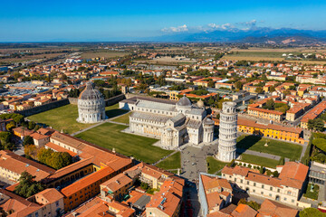 Pisa Cathedral and the Leaning Tower in a sunny day in Pisa, Italy. Pisa Cathedral with Leaning Tower of Pisa on Piazza dei Miracoli in Pisa, Tuscany, Italy. - 657133663