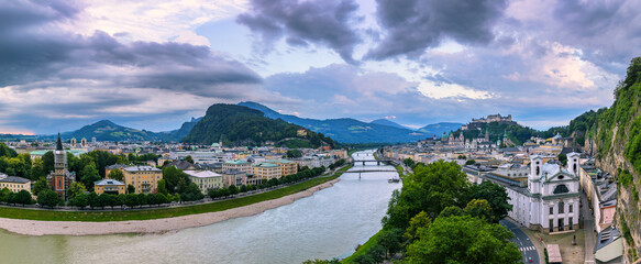 Beautiful view of the historic city of Salzburg with Festung Hohensalzburg in summer, Salzburger Land, Austria. Panoramic summer cityscape of Salzburg, Old City, birthplace of famed composer Mozart. - obrazy, fototapety, plakaty
