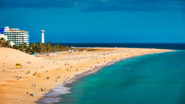 Morro Jable, Fuerteventura, Spain. Breathtaking beach Playa del Matorral in the rays of the sunset. Morro Jable and Playa del Matorral, Fuerteventura, Canary Islands, Spain, Atlantic, Europe