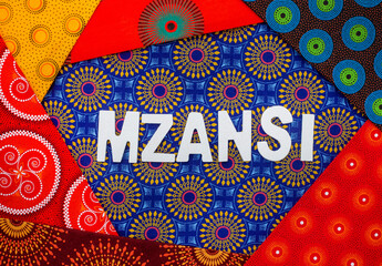Mzansi, a slang word for South Africa, in white letters with iconic South African Shwe Shwe fabric