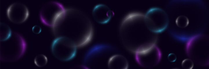 Abstract background with neon bubbles, iridescent colorful glass balls or spheres on a black background.