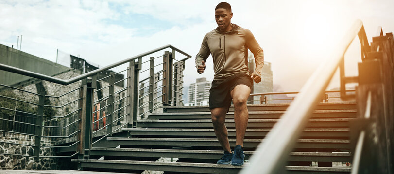 Fitness, City And Black Man Running On Steps Outdoor, Exercise And Training Healthy Body In The Morning. Sports, Cardio And African Athlete On Stairs For Endurance Workout, Energy Or Jog For Wellness