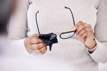 Person hands, cleaning glasses with cloth and vision, hygiene and maintenance, health and prescription lens with frame. Eyewear, fabric and improve eyesight, eye care and wellness with cleanliness