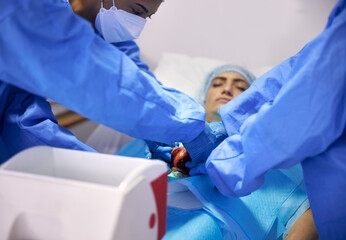 Heart, transplant and doctors team doing surgery or emergency operation for treatment or healing...