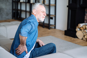 Senior man feeling pain and have lumbar osteochondrosis, inflammation