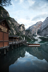 Beautiful mountain lake in the alps with boats, Italy, Dolomitas.