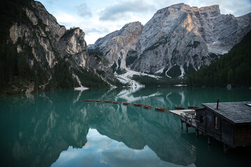 Beautiful mountain lake in the alps, on the lake boats, Italy