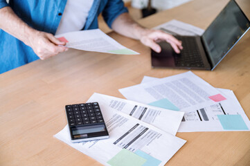 Selective focus on paper documents, utility bills for water supply, gas