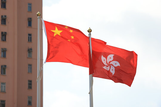 Chinese and hong kong flag set up in the event for celebrating the National Day of the People's Republic of China 74 th anniversary with the real estate background