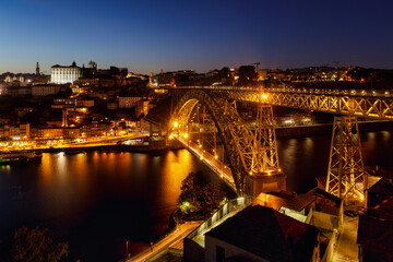 The Dom Luís I Bridge or Luís I Bridge, is a double-deck metal arch bridge that spans the River Douro between the cities of Porto and Vila Nova de Gaia in Portugal. - obrazy, fototapety, plakaty