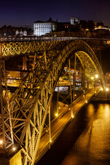 Obraz premium The Dom Luís I Bridge or Luís I Bridge, is a double-deck metal arch bridge that spans the River Douro between the cities of Porto and Vila Nova de Gaia in Portugal.