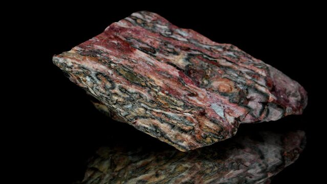 'Bird's Eye' Rhyolite (Mexico) Volcanic equivalent of granite specimen rotating slowly against a black background.