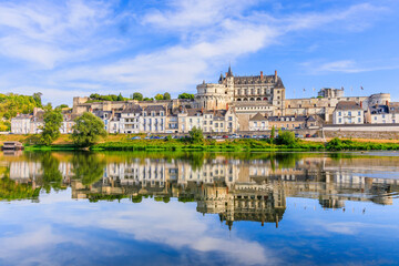 Fototapeta na wymiar Amboise, France. The walled town and Chateau of Amboise reflected in the River Loire.