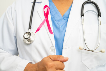 Breast cancer, Asian doctor woman with pink ribbon, symbol of World Breast Cancer Day.
