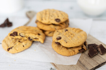 Homemade peanut butter cookies with chocolate chips. Morning breakfast biscuits. Peanut butter cookies stacked on a plate. Close up view.