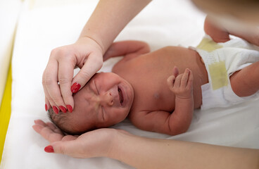 Medical examining healthcare. Newborn examination in pediatrician hospital.