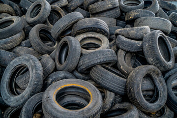 Recycling abandoned wheels. Old tires trash storage.