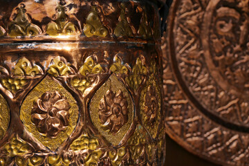 handmade patterned antique copper surface at the bazaar in Turkey