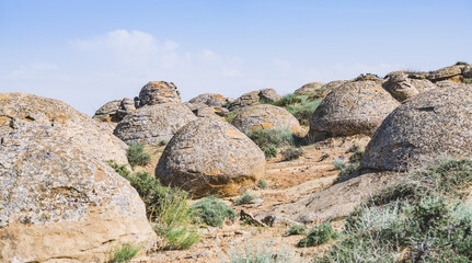 Fototapeta na wymiar Unusual spherical shape of stones in the Kazakh steppe Mangistau, valley of balls in nature Torysh