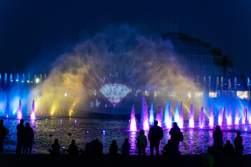 Fototapeta na wymiar Singing fountains glow incredibly at night