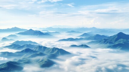 Fototapeta na wymiar Hazy mountains seen through wispy clouds