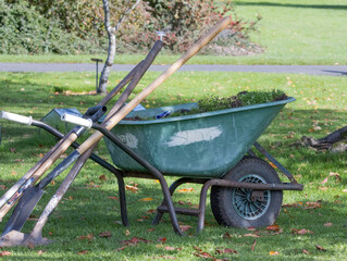 wheelbarrow and tools in the park