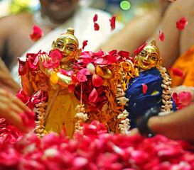 Abhishek with Flowers of Idol Krishna and Radha during Radhashtami Festival Celebration