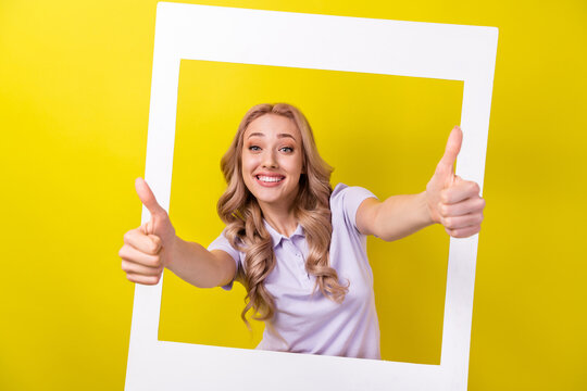 Photo of funky positive woman dressed violet t-shirt tacking photo showing two thumbs up isolated yellow color background