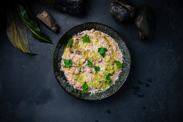 Italian risotto with parmesan, champignon and greens.