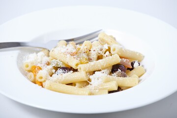 Plate of pasta with pepper and olives