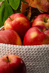 Red apples in a white handmade cross stich basket.