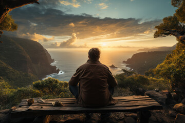 A person gazing at a breathtaking sunset over the ocean, pondering the vastness of the universe....