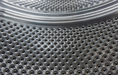 Closeup image of washing machine, abstract metallic texture background