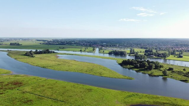 Aerial shot of the river spilling into the surrounding landscape, creating a unique habitat for rare species. The IJssel River near Zwolle
