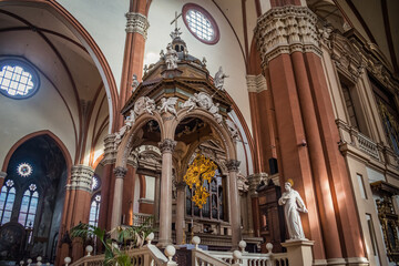 Ciborium of Vignola with golden crucifix, columns and decorated with statues of angels on top in Basilica di San Petronio, , Bologna ITALY © Liliana