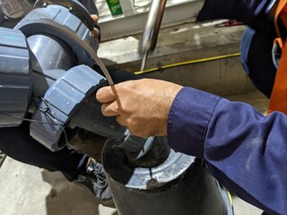 Welding PVC material for rectify leakage on PVC pipe line. The photo is suitable to use for...