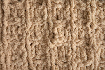 Yellow handmade knitting blanket background.