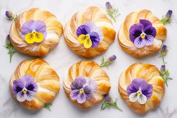 Foto op Aluminium Fresh buns pattern decorated with edible pansy flowers © colnihko