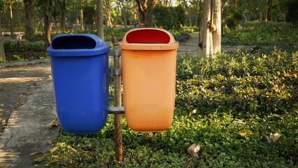 trash cans used to accommodate organic and non-organic waste from city parks