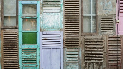 The walls of the unique house are made of old wooden windows