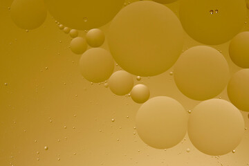 Abstract yellow background with oil circles water surface.