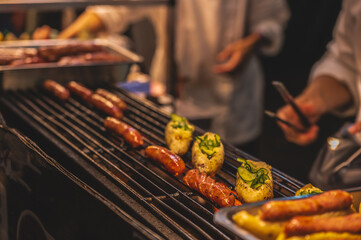 Taiwan hot dog on the stove in street food stall at liuhe night market.The Liuhe Night Market is a tourist night market in Sinsing District, Kaohsiung. It is one of the most popular markets in Taiwan