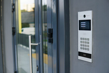 Video entrance doorbell in the entry of a modern house, technology and security concept. - obrazy, fototapety, plakaty