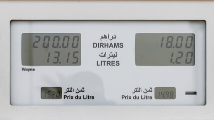 Gas station price on the gas pump. Concept of oil prices increasing.
