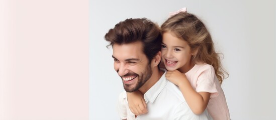 Woman with laptop being hugged by man and child with smiles With copyspace for text
